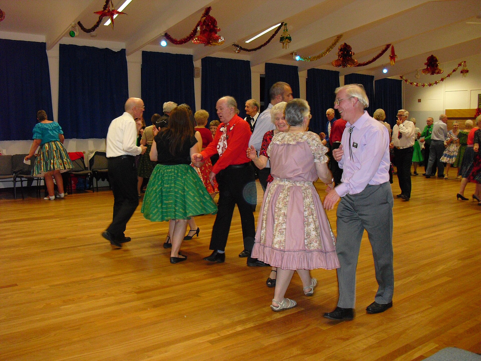 Square dancers enjoying a friendship dance in a community hall
