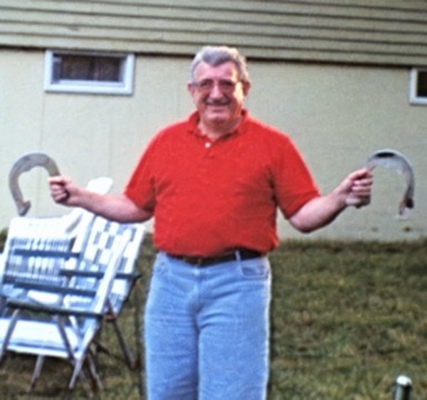 Jerry Maurice outdoors in a red shirt and jeans